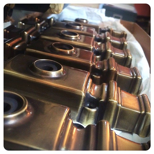 cremone bodies awaiting assembly | burnished antique brass