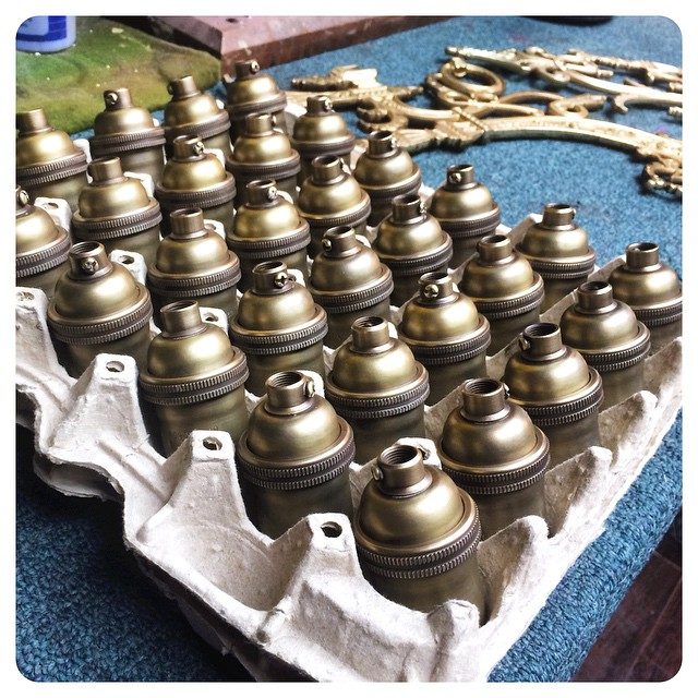 satin antique brass light sockets to be installed at a restaurant opening right here on Green Bay Road