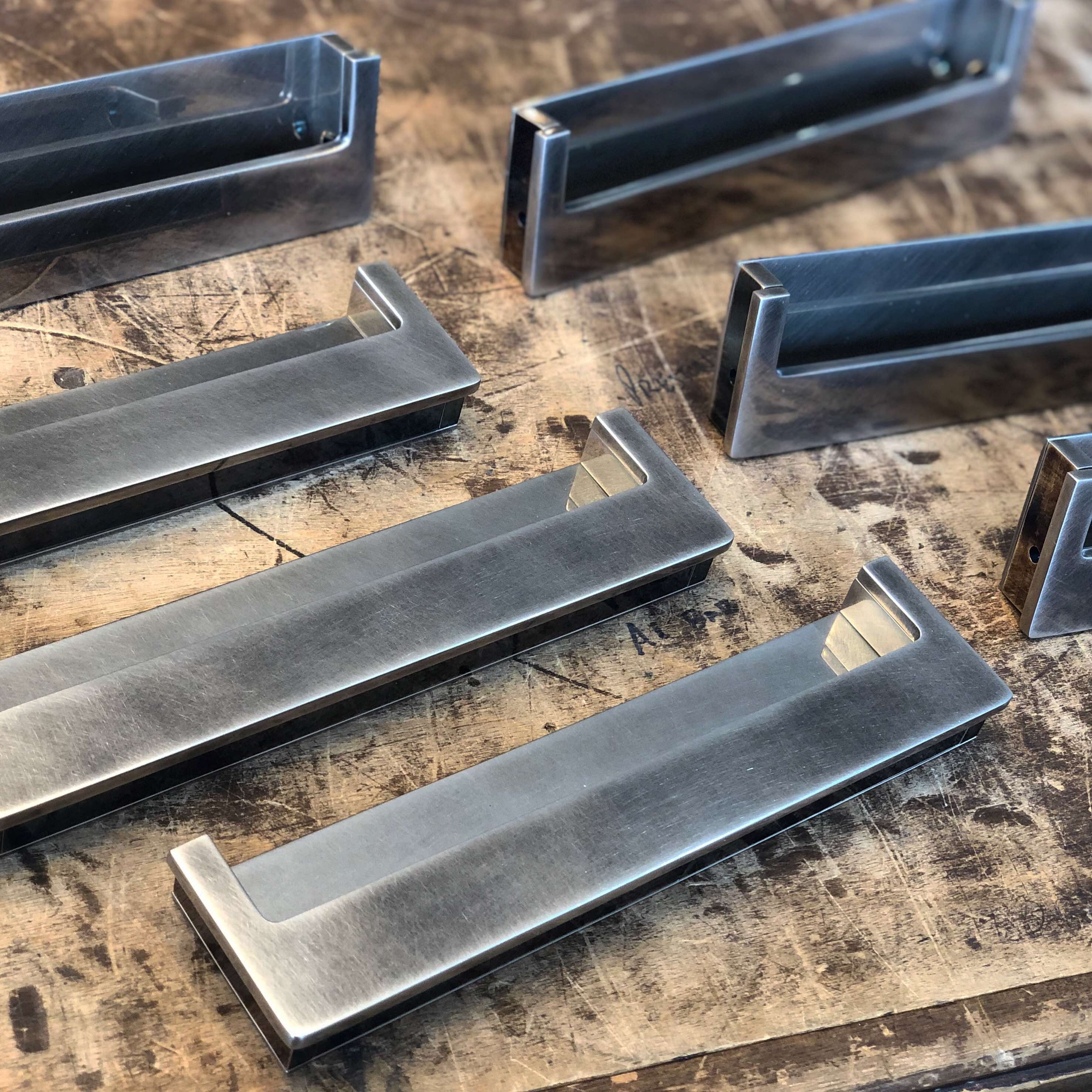 Recessed door and drawer pull assemblies in our smoked nickel finish